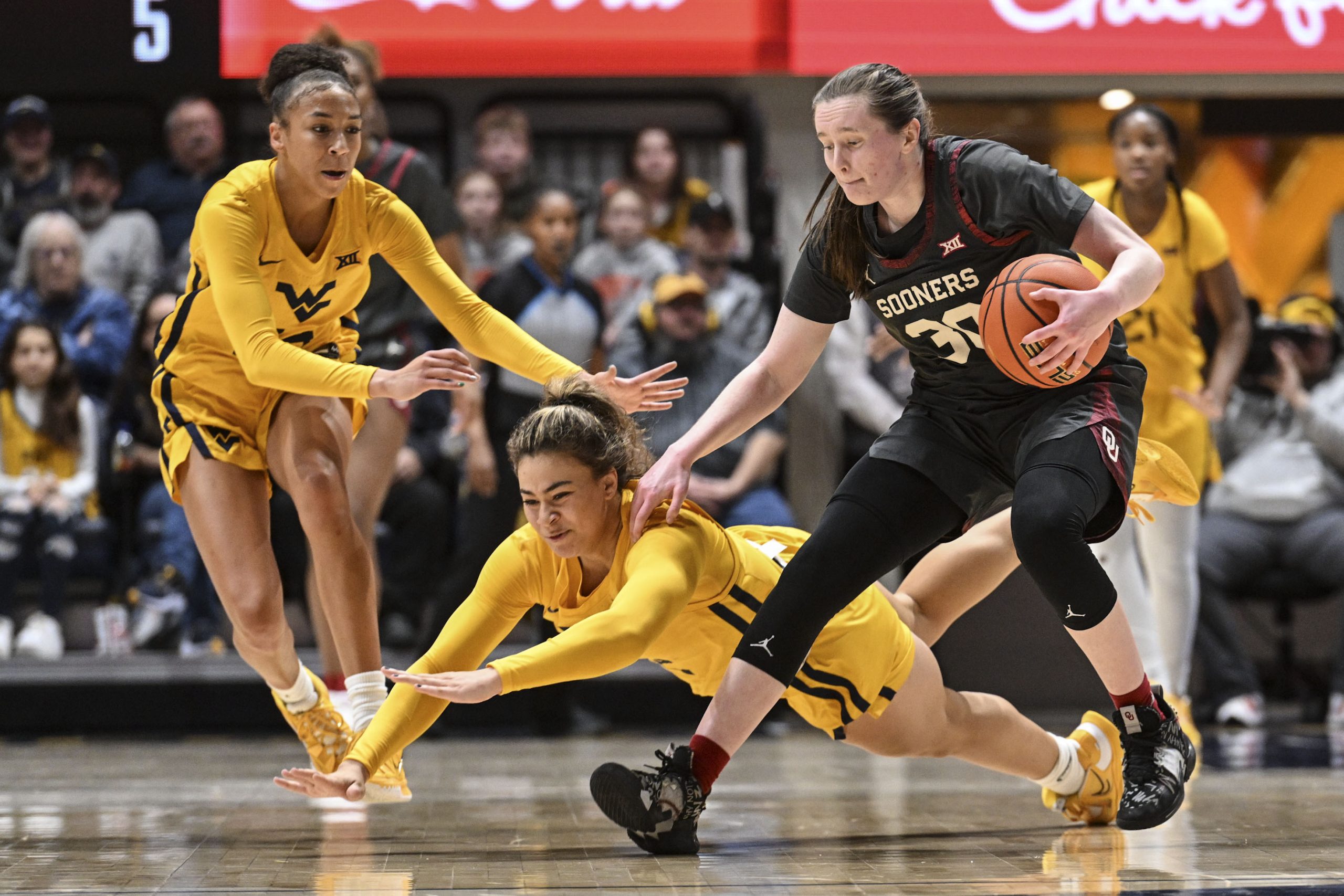 Oklahoma's offense too much for WVU to handle in Big 12 opener